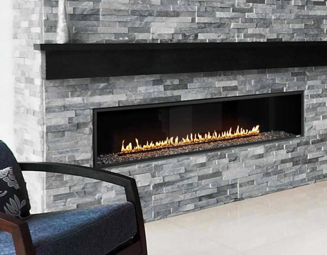 Modern linear gas fireplace with stacked stone surround