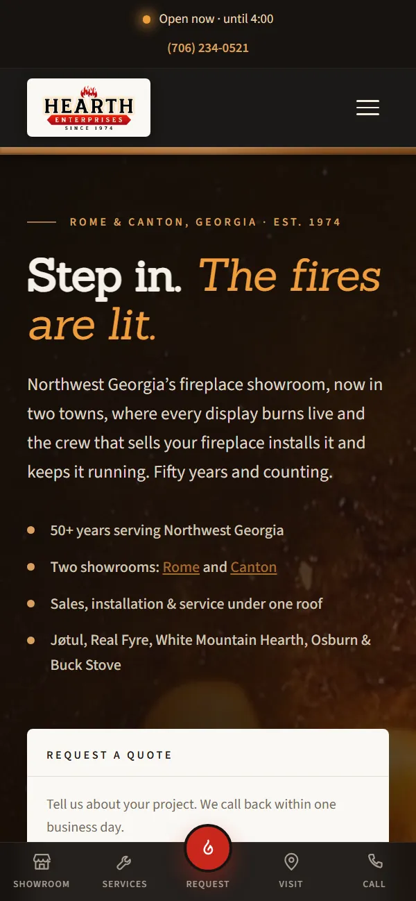 The Hearth Enterprises homepage on a phone. Firelight fills the left of the screen behind the headline Step in, the fires are lit, with a request-a-quote form panel on the right that asks which of the two showrooms is closer.