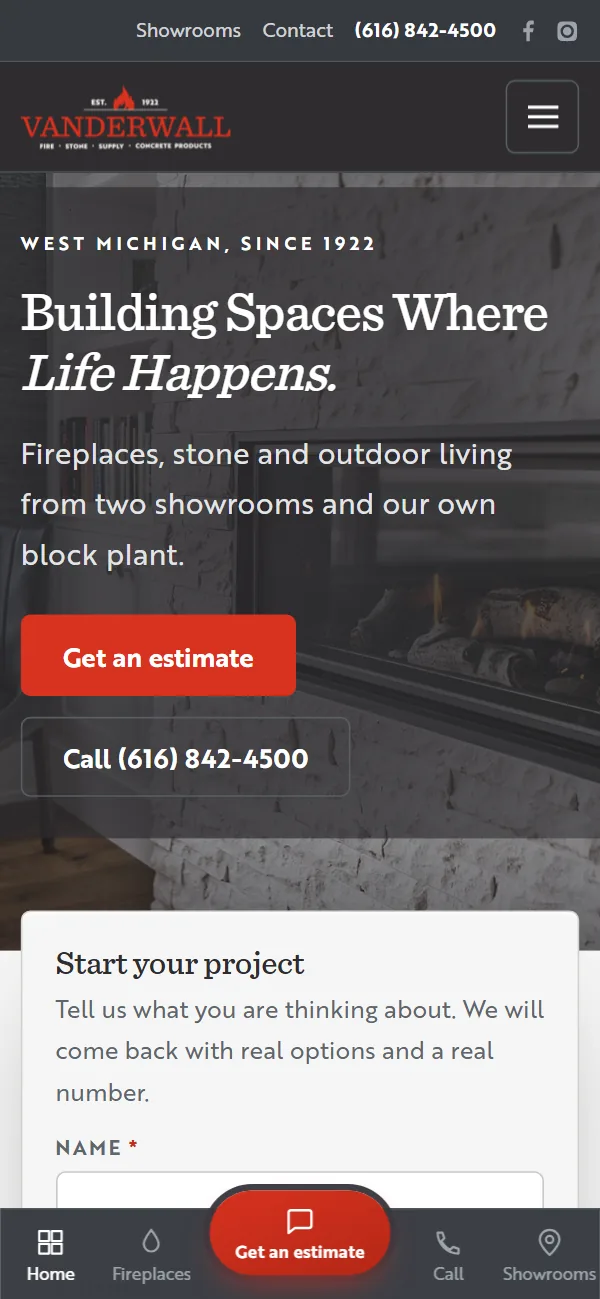 The VanderWall Brothers homepage on a phone. A lit linear fireplace fills the photograph behind the headline Building Spaces Where Life Happens, with a four-field project form across the bottom of the screen.