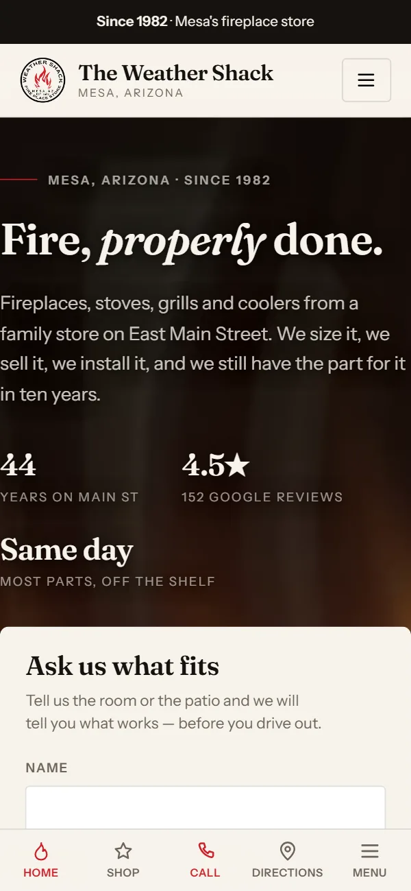The Weather Shack homepage on a phone. A close photograph of burning logs behind the headline Fire, properly done, with an Ask us what fits form on the right that takes photos of the room.