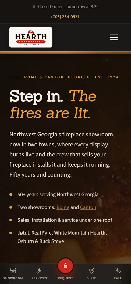 The Hearth Enterprises homepage on a phone, headline Step in, the fires are lit, with a call button and a bottom tab bar.
