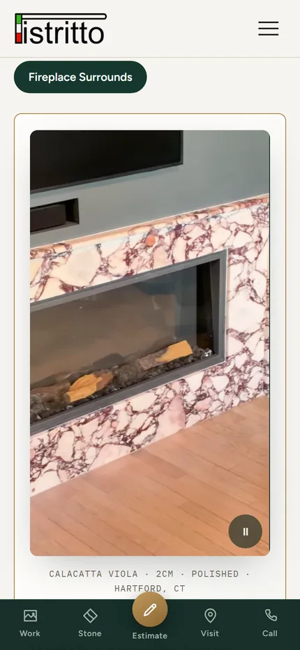 A Pistritto Marble fireplace surround gallery on a phone, showing a stone surround around a lit firebox.